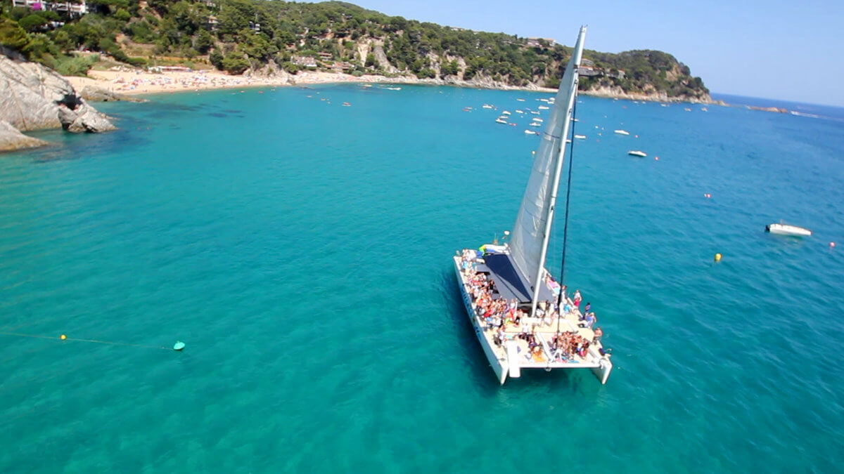 Party Boat in Costa Brava, North of Barcelona. Enjoy the blue water and jump from the boat for a refreshing swim during the hot summer of Barcelona